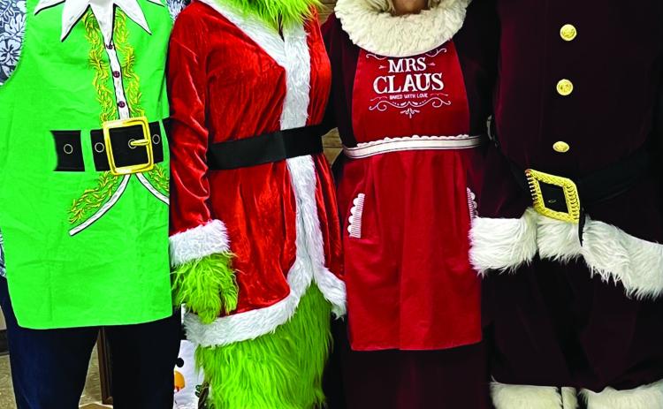 Santa and Mrs. Claus popped into town last week for the Stonewall Memorial Hospital District Christmas party, catching up with the Grinch and another jolly old elf, SMHD CEO Michael Moorhead.