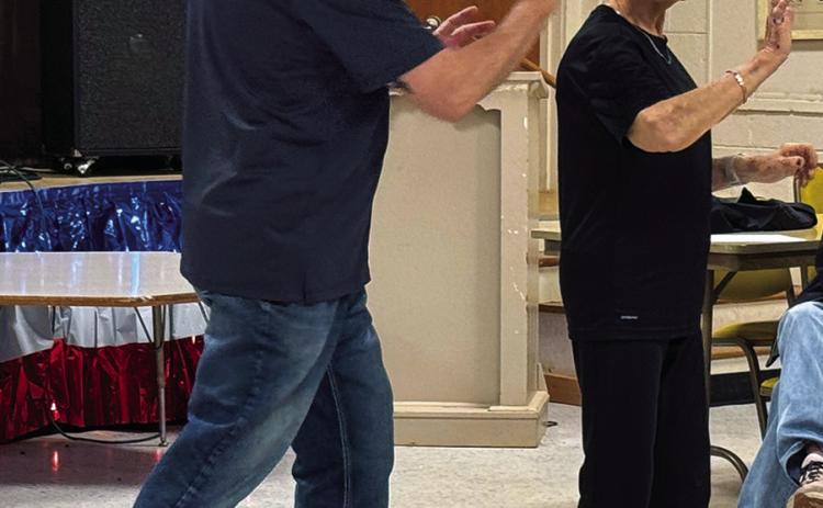 Mildred Crouch of Hamlin, Texas learns self-defense techniques in Old Glory Saturday afternoon at the women's self-defense seminar conducted by Scott Feagan and coordinated by Jan Harris.