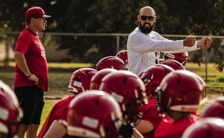 Roby Head Coach Zane Graves leads his team through pad drills at morning practice. Photo by Mark Martinez.