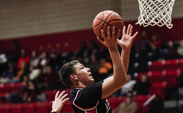 Aspermont Freshman Jaxon Hodges puts up shot during the Hornets 42-34 loss to Anson Tuesday night. This weekend, the JV Boys will travel to take part in the Guthrie tournament while the Varsity Boys will take part in the Munday tournament respectively. PHOTO BY: MARK MARTINEZ