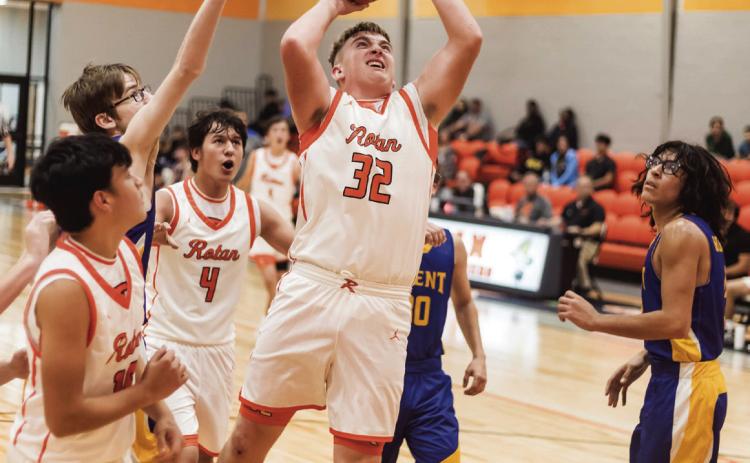 Left: Rotan Senior Hunter Harris puts up a rebound shot during the Hammers' 62-24 win over the Trent Gorillas Tuesday night. The Hammers will take part in the Wellman Tourney this weekend Thursday - Saturday TBD PHOTO BY: MARK MARTINEZ
