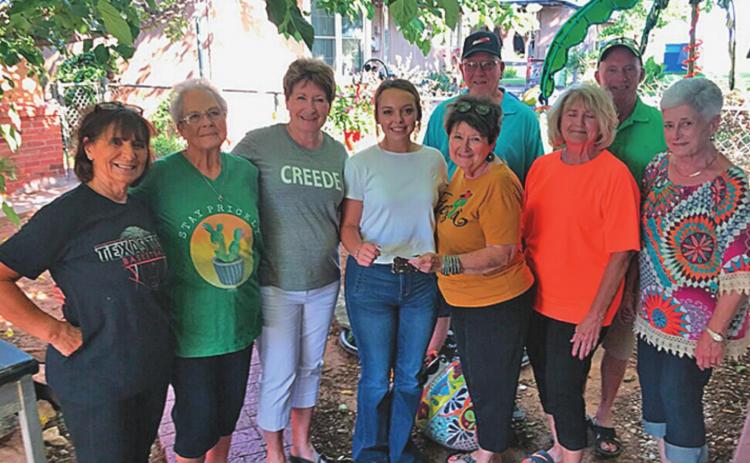 Left to right, Susan Kiker, Dianne Feagan, Gay Nell Cherry, Payton Dickson, Betty Joy Vaught, Sano Upshaw, Ginger Jones. Back row, Calvin Jones, Fenton Brown.