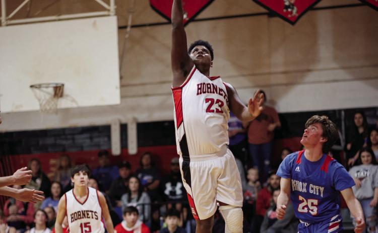Aspermont's Donovan Miller lays up a shot during the Hornets 60-71 loss to Knox City last Friday night. The Hornets finished district play with a record of 11-1, tieing with the Greyhounds. Aspermont and Knox City will compete one more time to determine playoff seeding this Friday night at 6pm in Rule. PHOTO BY TRICIA HURT