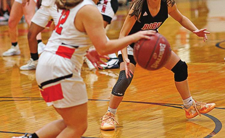 Roby's Lily Benson transitions into her defensive stance during the Lady Lions' 48-43 win over Rotan Tuesday night. Photo by: Tricia Hurt