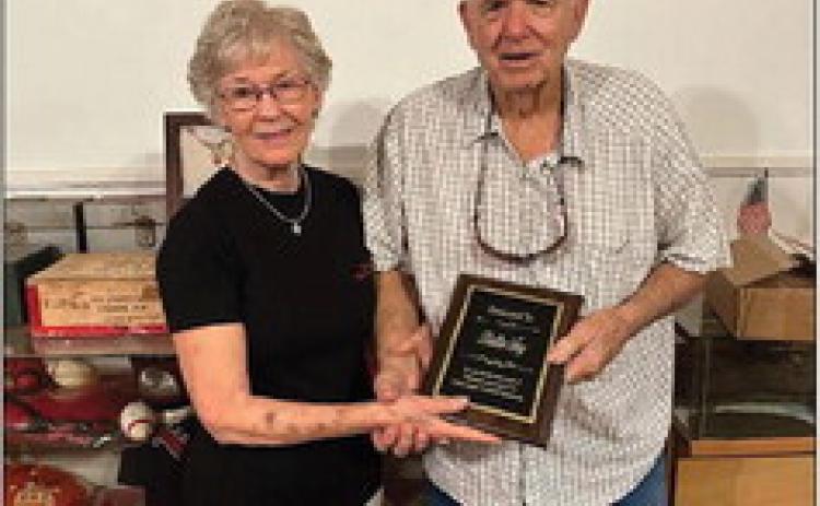 Jerry Fry accepted a plaque presented by Dot Harris in memory of Bettie Fry and her long-time service and dedication to the museum and the Historical Commission.
