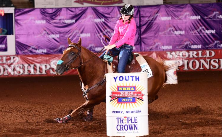 Cissa Dixon, daughter of Katrina and Chase Jarvis or Rotan, rounds the last barrel during her run last year at the NBHA World Championship in Perry, Georgia (Courtesy Photo)