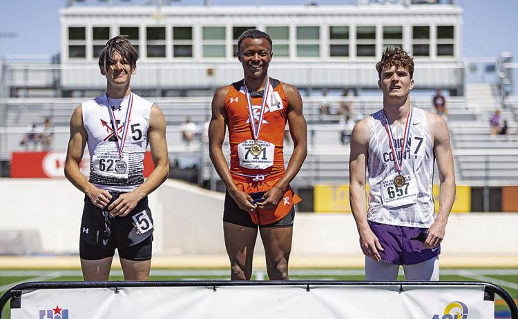 Rotan Senior Jordan Daniel is all smiles as he stands on the podium in the first place spot. Jordan will be advancing to the state meet in the 100 m and the 200 meter dash. He placed 1st in both events at the Regional meet held last weekend at Angelo State University. PHOTO BY MARK MARTINEZ